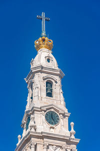 Low angle view of cathedral against clear blue sky