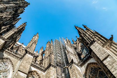 Low angle view of traditional building against blue sky