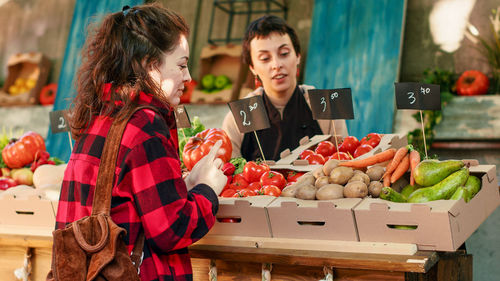 Portrait of young woman holding food