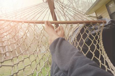 Close-up of woman relaxing on bed