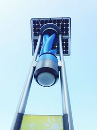 Low angle view of lamp post against blue sky