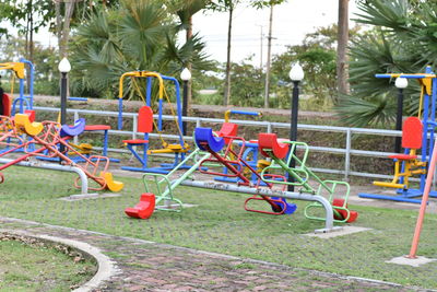 View of playground against trees in park