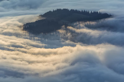 Aerial view of clouds and mountain