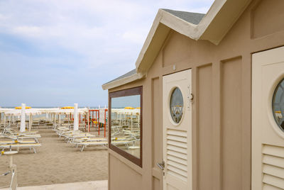 Row of chairs on beach