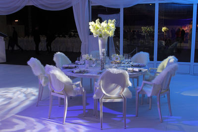 Empty chairs and tables in restaurant