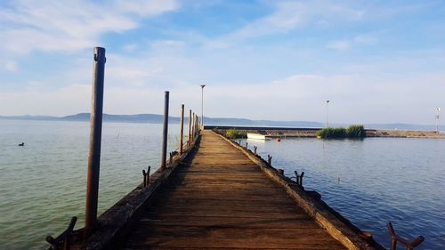 Pier over sea against sky