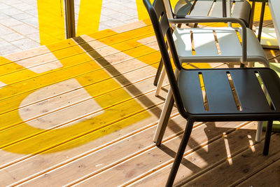 High angle view of chairs on wooden floor