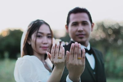 Portrait of couple standing outdoors