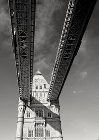 Low angle view of tower and building against sky