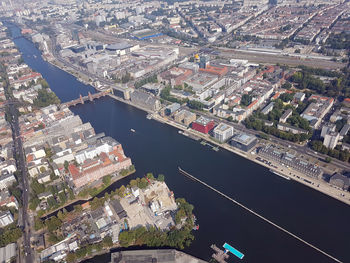 High angle view of buildings by sea