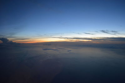 Scenic view of landscape against sky at sunset