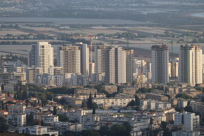 High angle view of buildings in city against sky