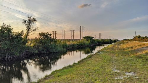 Scenic view of canal against sky