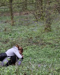 Woman taking picture on field