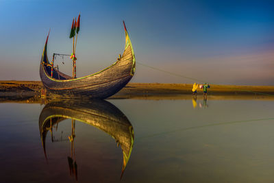 Boat moored in lake