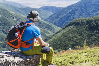 Rear view of man looking at mountain