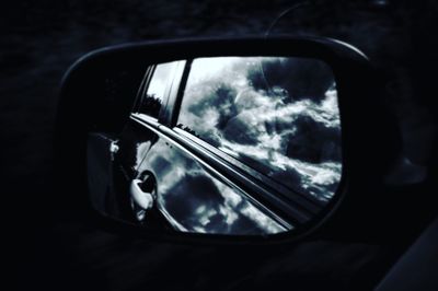 Reflection of car on side-view mirror