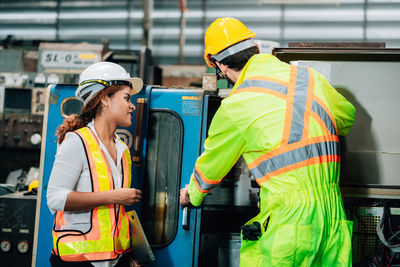 Side view of people working