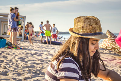 Woman wearing hat on beach