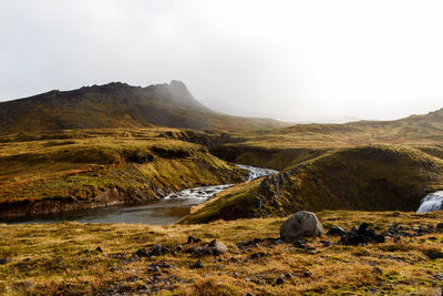 Scenic view of landscape and mountains against sky
