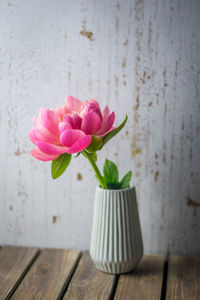 Close-up of pink flower vase on table