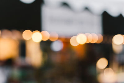 Defocused image of illuminated city at night