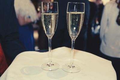 Champagne flutes on tray in restaurant