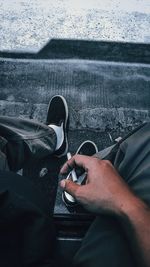 Low section of man legs on car