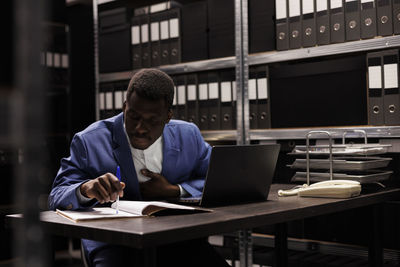 Man using laptop at office