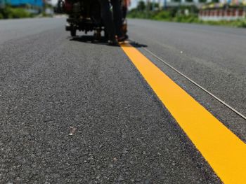 Close-up of yellow line on street