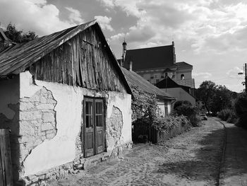 Houses against cloudy sky