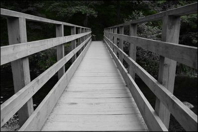 Empty footbridge along footpath