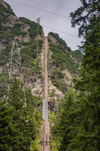 Railway up a hill to gelmer lake with electricity cables.