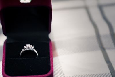 Close-up of wedding rings on box