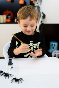Portrait of boy playing with toy blocks
