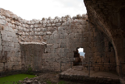 Stone wall of old ruin building