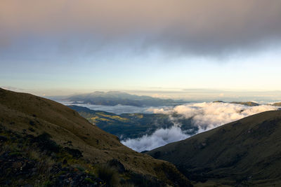 Scenic view of volcanic landscape against sky during sunset