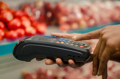 Close-up of hand holding camera