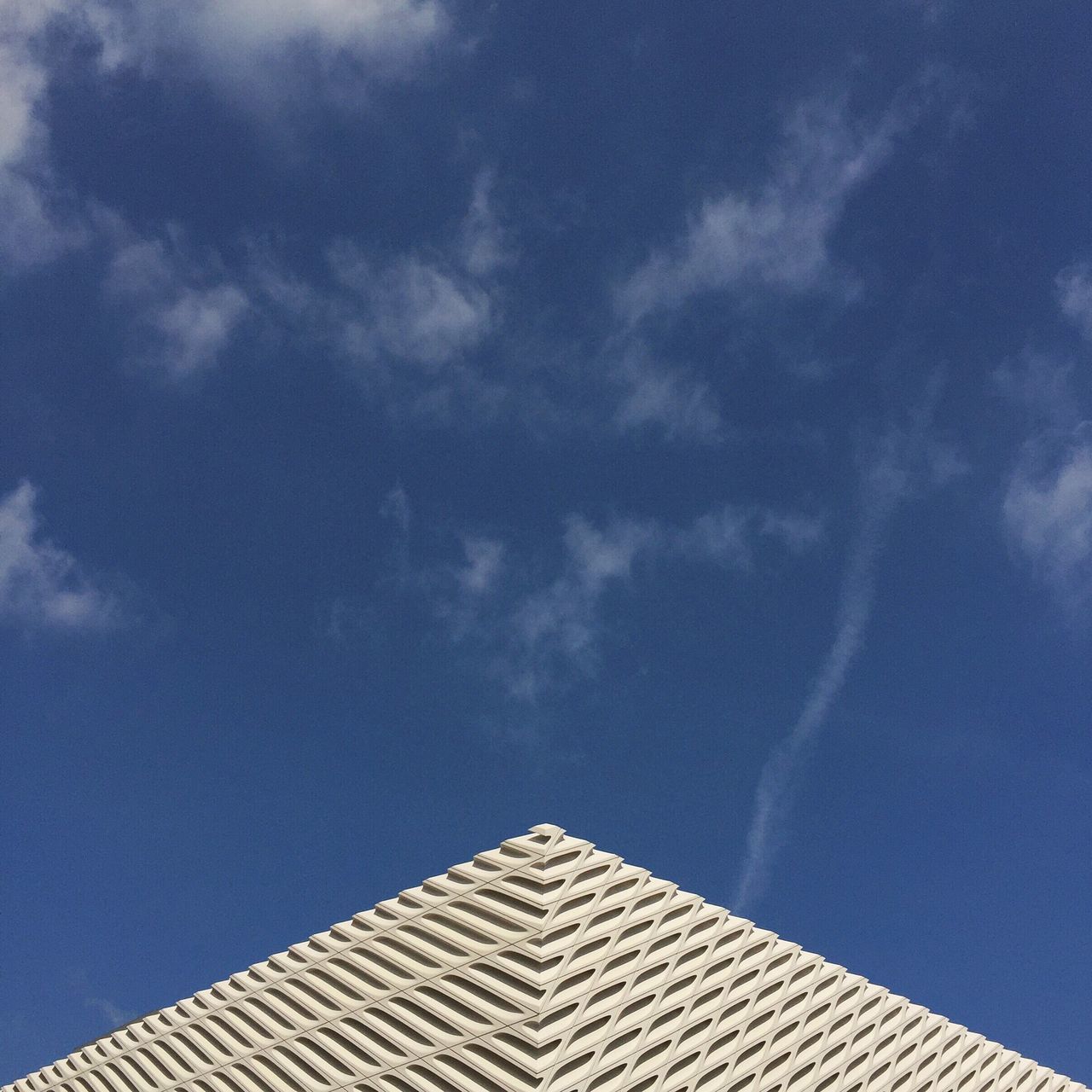 low angle view, architecture, building exterior, built structure, blue, sky, cloud - sky, high section, cloud, building, outdoors, day, roof, no people, cloudy, city, modern, nature, directly below, residential structure