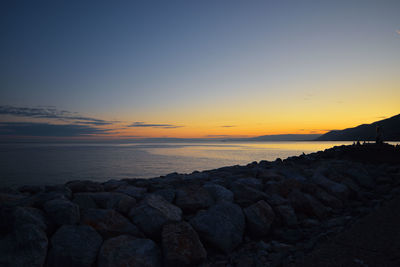 Scenic view of sea against sky during sunset