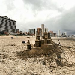 Buildings against cloudy sky