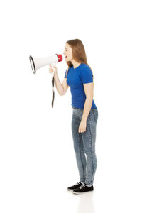 Full length of woman standing against white background