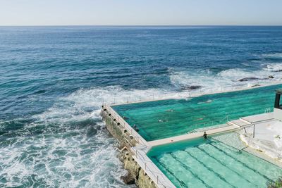 People swimming in the icebergs pool in bondi beach in sydney