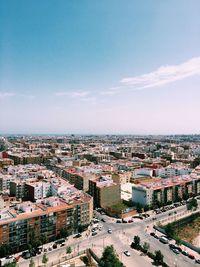 High angle view of buildings in city against sky