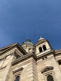 Low angle view of building against blue sky