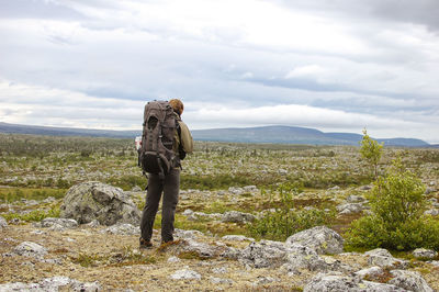 Rear view of solitary hiker in sweden