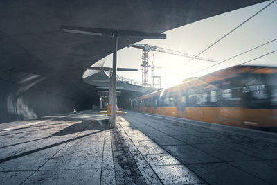 Motion-blurred view of incoming train in modern subway station, stuttgart staatsgalerie