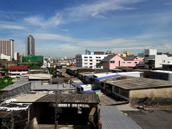 High angle view of buildings in city against sky