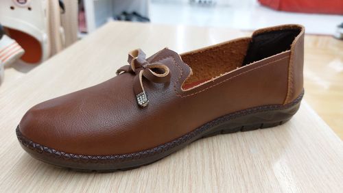 Close-up of shoes on table