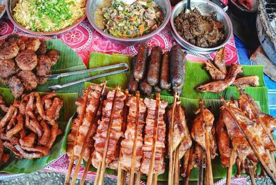 High angle view of meat on barbecue grill